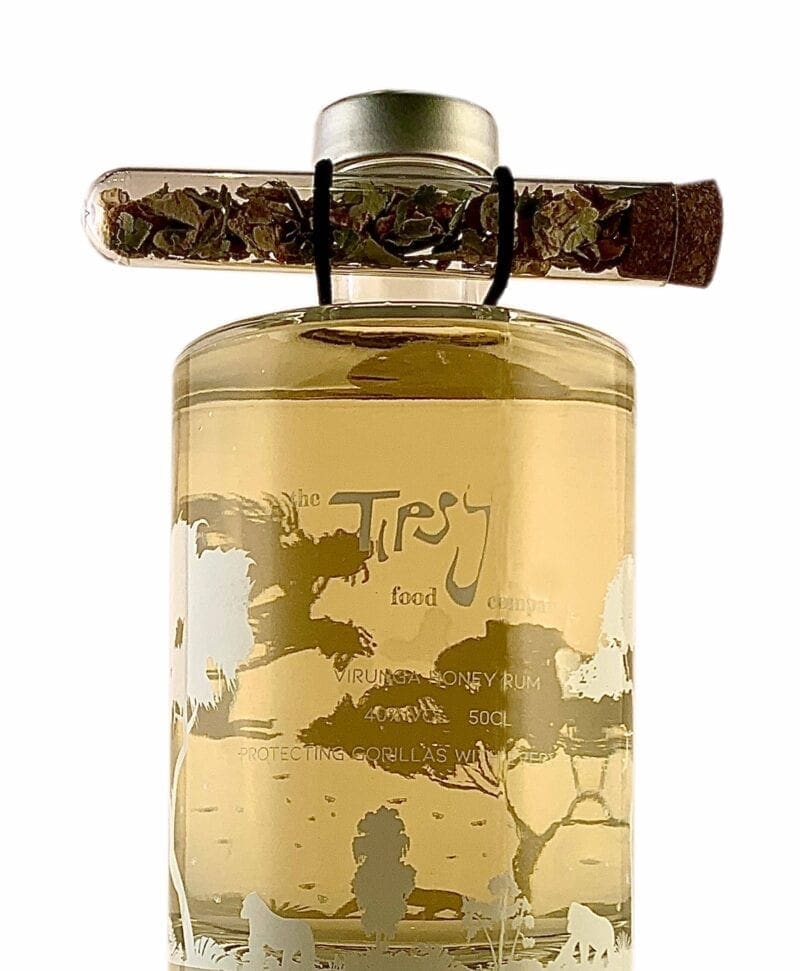 A bottle of tea with a stick in it.