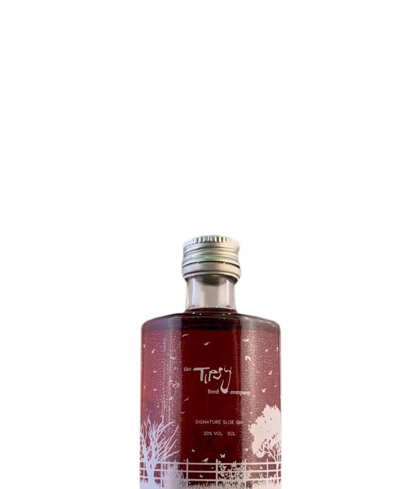 A bottle of red gin on a white background.